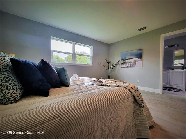 2309 Dairy Rd, Melbourne, FL 32904 - bedroom with baseboards and light wood finished floors