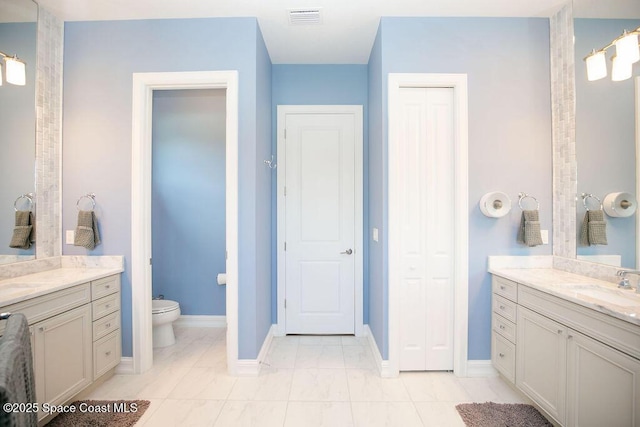 7354 Lucaya Ct, Melbourne, FL 32940 - bathroom with two vanities and a closet