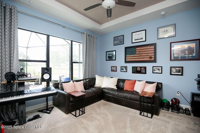 7354 Lucaya Ct, Melbourne, FL 32940 - living area with ceiling fan and carpet flooring