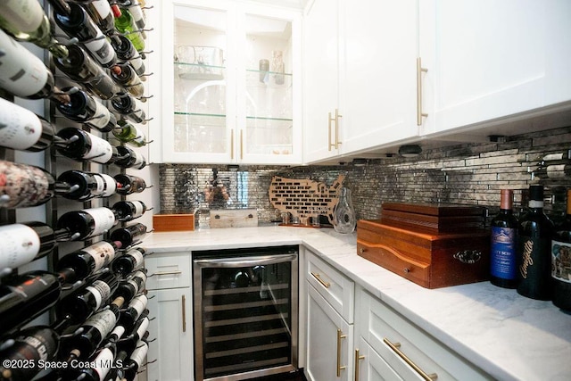 7354 Lucaya Ct, Melbourne, FL 32940 - wine cellar with beverage cooler and bar area