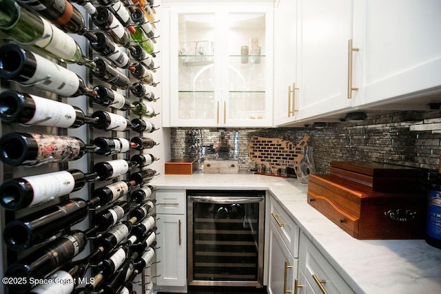 7354 Lucaya Ct, Melbourne, FL 32940 - wine cellar featuring beverage cooler and a bar