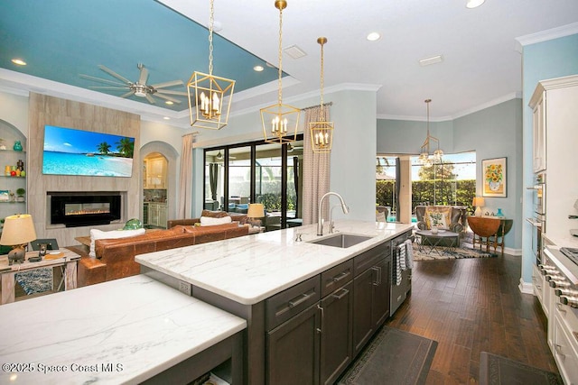 7354 Lucaya Ct, Melbourne, FL 32940 - kitchen featuring a chandelier, recessed lighting, open floor plan, ceiling fan, and a fireplace