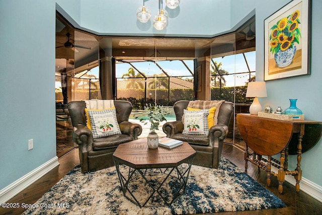 7354 Lucaya Ct, Melbourne, FL 32940 - living area featuring a sunroom, wood finished floors, and ceiling fan