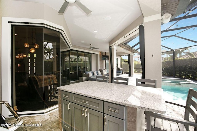 7354 Lucaya Ct, Melbourne, FL 32940 - view of patio with a ceiling fan, a bar, a pool with connected hot tub, and a lanai