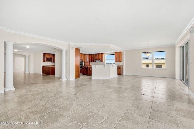 225 N Atlantic Ave Unit 603, Cocoa Beach, FL 32931 - unfurnished living room featuring ornamental molding and decorative columns