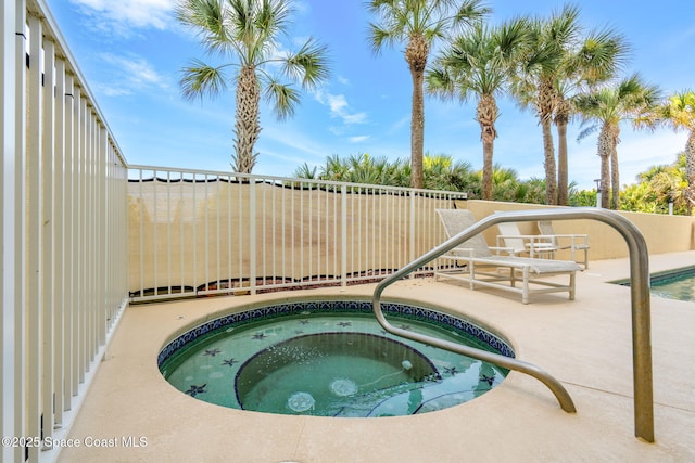 225 N Atlantic Ave Unit 603, Cocoa Beach, FL 32931 - view of pool featuring an in-ground hot tub and a patio