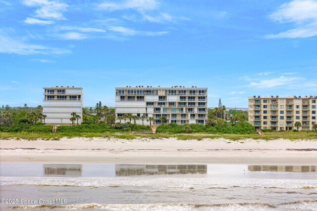 225 N Atlantic Ave Unit 603, Cocoa Beach, FL 32931 - view of building exterior with view of water and beach