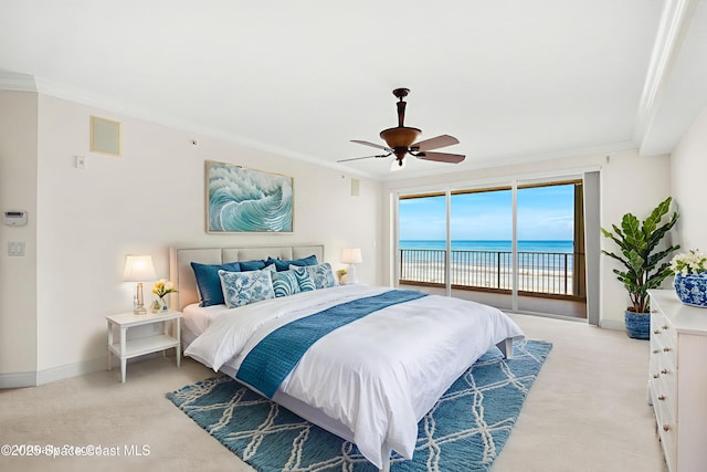 225 N Atlantic Ave Unit 603, Cocoa Beach, FL 32931 - bedroom with access to outside, ornamental molding, light carpet, a water view, and ceiling fan