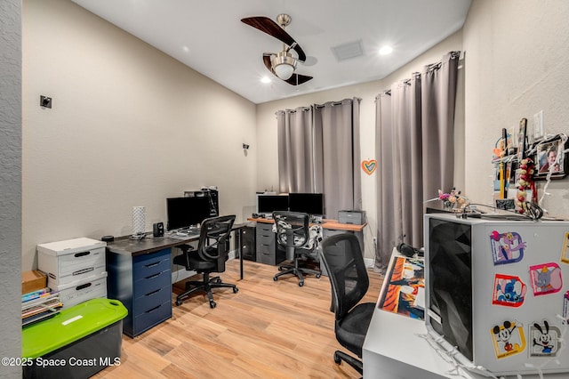 4554 Preservation Cir, Melbourne, FL 32934 - home office with light wood finished floors, recessed lighting, and a textured wall