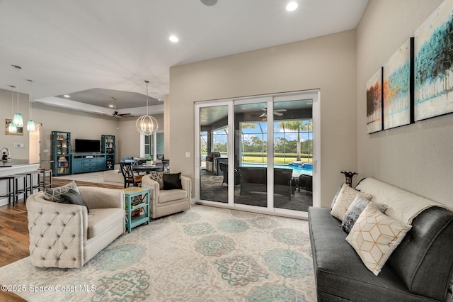 4554 Preservation Cir, Melbourne, FL 32934 - living area with recessed lighting, ceiling fan, wood finished floors, and a chandelier