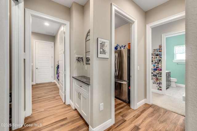 4554 Preservation Cir, Melbourne, FL 32934 - hall featuring light wood-type flooring and baseboards