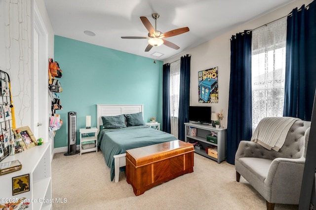 4554 Preservation Cir, Melbourne, FL 32934 - bedroom with light carpet, multiple windows, and ceiling fan