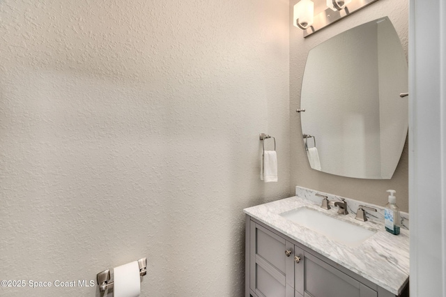 4554 Preservation Cir, Melbourne, FL 32934 - bathroom with vanity and a textured wall
