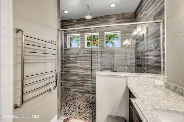4554 Preservation Cir, Melbourne, FL 32934 - bathroom featuring vanity, a stall shower, and recessed lighting