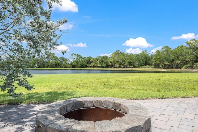 4554 Preservation Cir, Melbourne, FL 32934 - view of patio / terrace featuring a fire pit and a water view