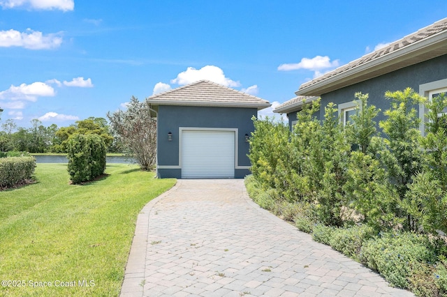 4554 Preservation Cir, Melbourne, FL 32934 - garage with a water view and driveway