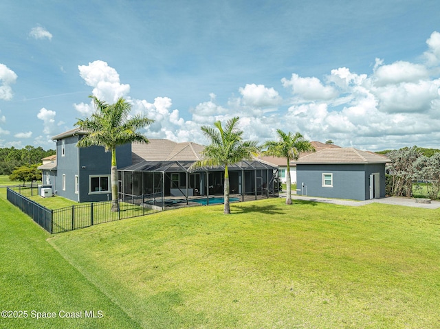 4554 Preservation Cir, Melbourne, FL 32934 - rear view of property with glass enclosure and a fenced backyard