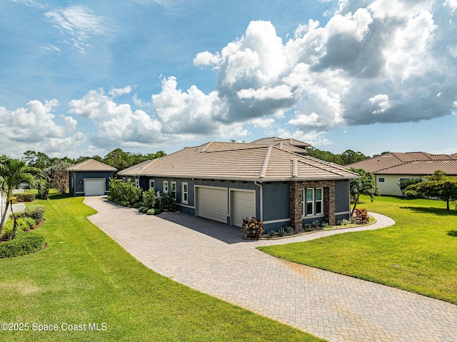 4554 Preservation Cir, Melbourne, FL 32934 - ranch-style house with a tile roof, a front yard, a garage, decorative driveway, and stone siding