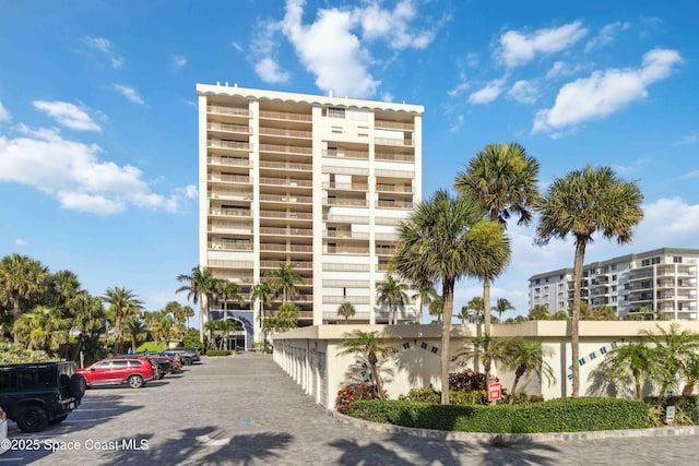 750 N Atlantic Ave Unit 203, Cocoa Beach, FL 32931 - view of apartment building / complex with uncovered parking