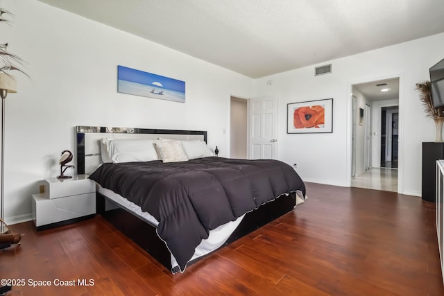 750 N Atlantic Ave Unit 203, Cocoa Beach, FL 32931 - bedroom featuring wood finished floors and baseboards
