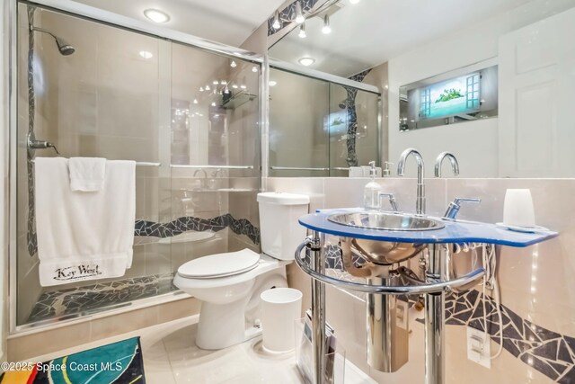 750 N Atlantic Ave Unit 203, Cocoa Beach, FL 32931 - full bath with a shower stall and tile patterned floors