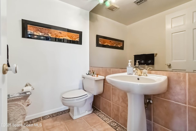 750 N Atlantic Ave Unit 203, Cocoa Beach, FL 32931 - bathroom featuring tile patterned floors and toilet