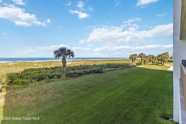 750 N Atlantic Ave Unit 203, Cocoa Beach, FL 32931 - view of green lawn featuring a water view