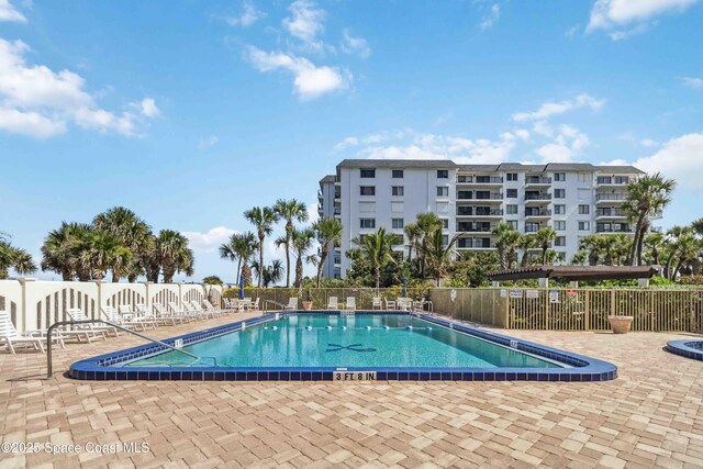 750 N Atlantic Ave Unit 203, Cocoa Beach, FL 32931 - community pool with a patio area