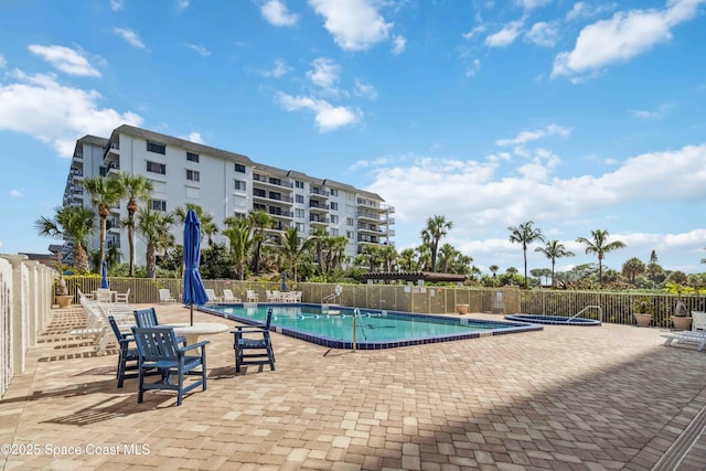 750 N Atlantic Ave Unit 203, Cocoa Beach, FL 32931 - community pool featuring a patio area