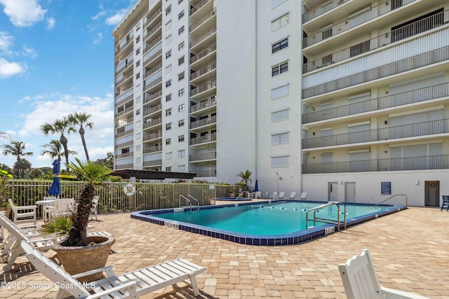 750 N Atlantic Ave Unit 203, Cocoa Beach, FL 32931 - community pool featuring a patio