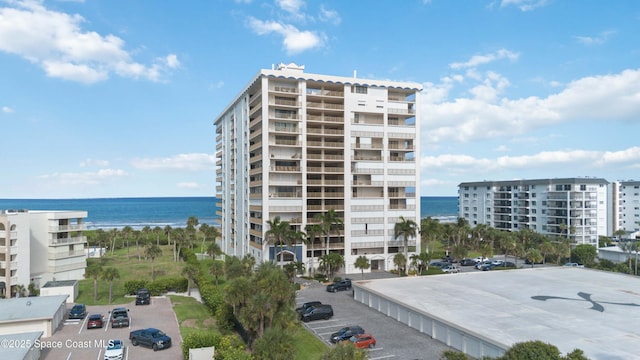 750 N Atlantic Ave Unit 203, Cocoa Beach, FL 32931 - view of apartment building / complex with a water view and uncovered parking