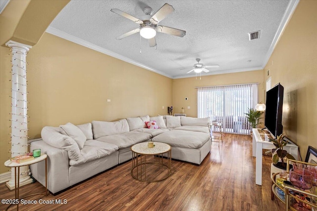2097 Hidden Grove Ln Unit 106, Merritt Island, FL 32953 - living area with a ceiling fan, a textured ceiling, wood finished floors, ornamental molding, and ornate columns