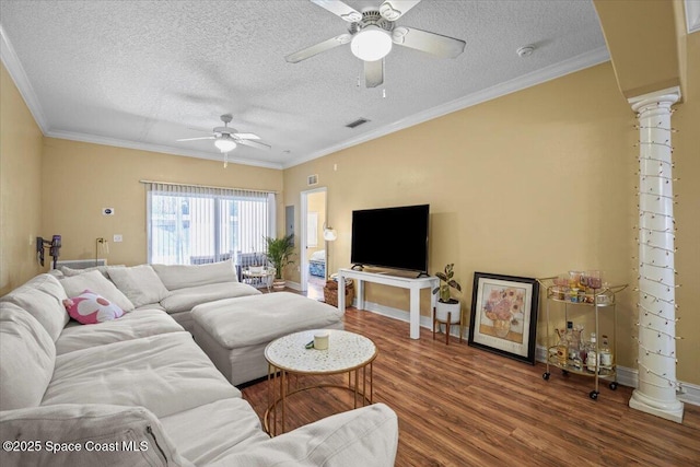 2097 Hidden Grove Ln Unit 106, Merritt Island, FL 32953 - living room with ceiling fan, a textured ceiling, wood finished floors, ornamental molding, and ornate columns