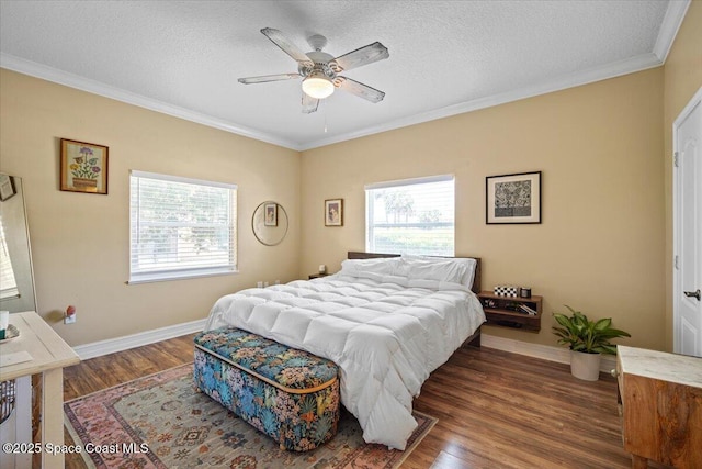 2097 Hidden Grove Ln Unit 106, Merritt Island, FL 32953 - bedroom with ornamental molding, wood finished floors, a textured ceiling, and ceiling fan
