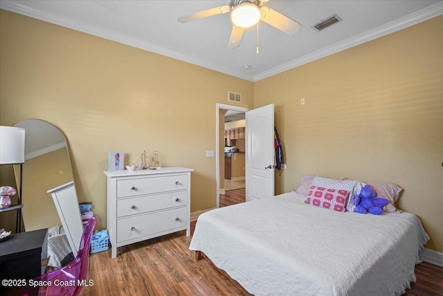 2097 Hidden Grove Ln Unit 106, Merritt Island, FL 32953 - bedroom with wood finished floors, ornamental molding, and a ceiling fan