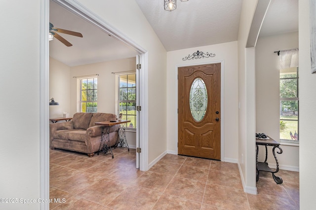 690 Grant Rd, Palm Bay, FL 32909 - foyer with light tile patterned floors and ceiling fan