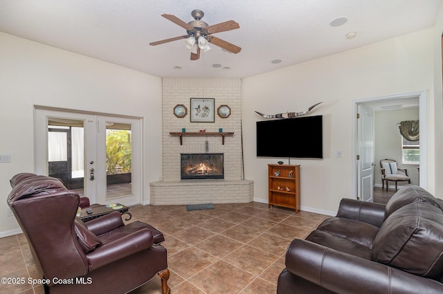 690 Grant Rd, Palm Bay, FL 32909 - tiled living room featuring ceiling fan, plenty of natural light, a brick fireplace, and french doors