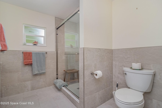 690 Grant Rd, Palm Bay, FL 32909 - full bathroom with tiled shower, tile walls, and a wainscoted wall