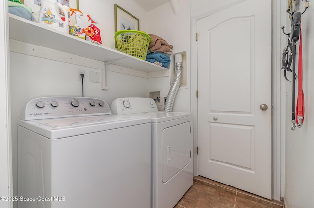 690 Grant Rd, Palm Bay, FL 32909 - washroom featuring washing machine and clothes dryer and tile patterned floors