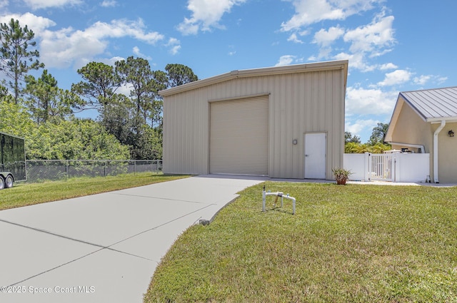 690 Grant Rd, Palm Bay, FL 32909 - detached garage with driveway and a gate