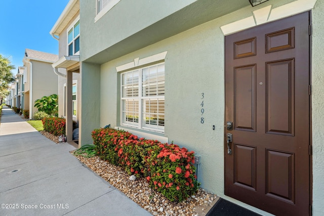 3498 Cutty Sark Way, Indialantic, FL 32903 - entrance to property with stucco siding