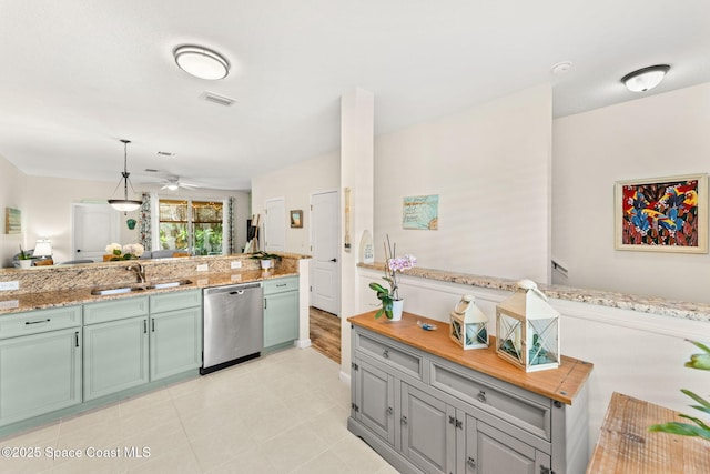 3498 Cutty Sark Way, Indialantic, FL 32903 - kitchen with dishwasher, a ceiling fan, green cabinets, light tile patterned flooring, and pendant lighting