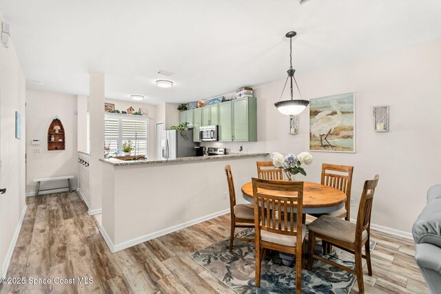 3498 Cutty Sark Way, Indialantic, FL 32903 - dining area featuring light wood finished floors and baseboards