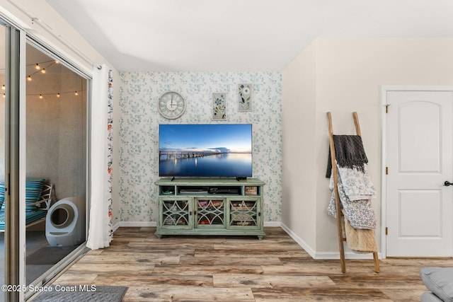 3498 Cutty Sark Way, Indialantic, FL 32903 - living room featuring wood finished floors and wallpapered walls