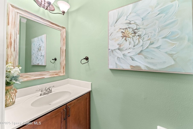 3498 Cutty Sark Way, Indialantic, FL 32903 - bathroom with vanity and a textured wall