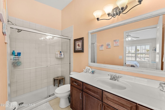 3498 Cutty Sark Way, Indialantic, FL 32903 - ensuite bathroom featuring vanity, a shower stall, ceiling fan, and tile patterned floors