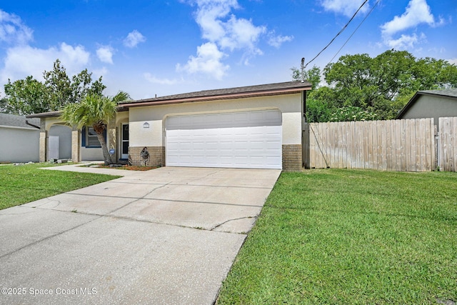 1327 Canterbury Ln, Rockledge, FL 32955 - view of front facade with brick siding, concrete driveway, a garage, and stucco siding