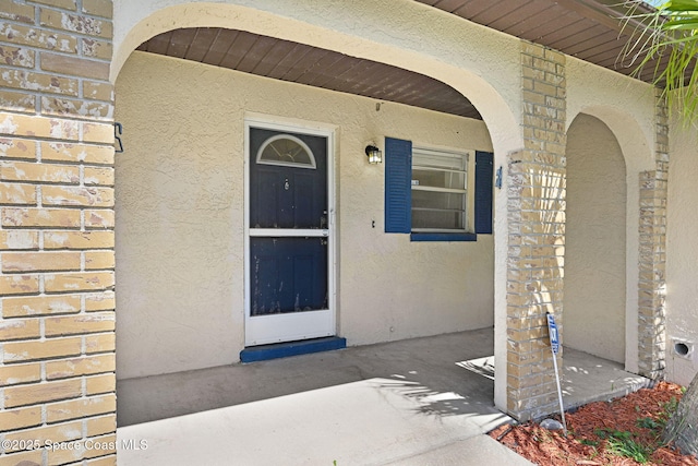 1327 Canterbury Ln, Rockledge, FL 32955 - doorway to property with stucco siding and brick siding