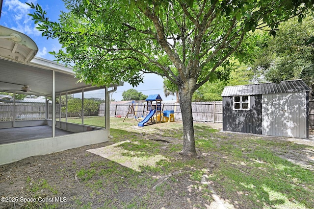 1327 Canterbury Ln, Rockledge, FL 32955 - fenced backyard with a playground, a storage shed, and a sunroom