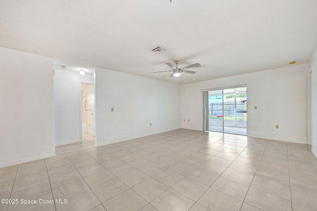 1327 Canterbury Ln, Rockledge, FL 32955 - spare room with ceiling fan, a textured ceiling, and light tile patterned floors